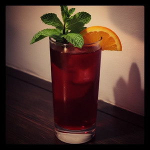 An image of the #3 Cup cocktail submitted by n0tquitethere that contains Cognac, Ginger Beer, Sweet Vermouth, Curaçao Triple Sec, Cherry Brandy, Lemon, Mint, Mint, Cucumber and Orange