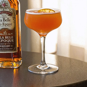 An image of the La Belle Epoque cocktail submitted by n0tquitethere that contains Cognac, Lemon, Yellow Chartreuse, Simple Syrup, Benedictine DOM, Angostura Bitters and Lemon