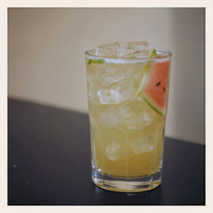 An image of the Melon Stand cocktail submitted by Toby that contains London Dry Gin, Water Melon Juice, Lemon, Aperol, Simple Syrup and Water Melon