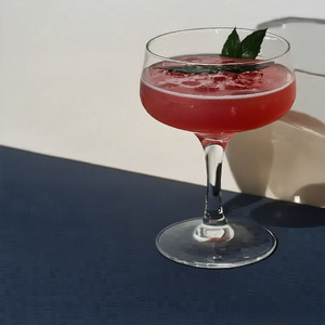 An image of the Rose cocktail submitted by Toby that contains London Dry Gin, Cherry Brandy, Orange Bitters and Cocktail Cherry