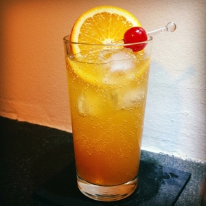 An image of the Blue Run Sling cocktail submitted by Toby that contains Bourbon, Averna, Apple Juice, Lemon, Vanilla Syrup, Orange and Cocktail Cherry