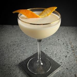 An image of the Deansgate cocktail submitted by Toby that contains White Rum, Lime Cordial, Drambuie and Orange