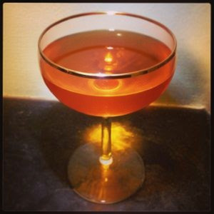 An image of the Dogfight cocktail submitted by Toby that contains Bourbon, Amaro Nonino, Aperol, Orange Bitters and Lemon