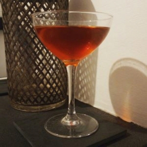 An image of the Elephant's Tale cocktail submitted by Toby that contains London Dry Gin, Lime, Cherry Brandy and Grenadine