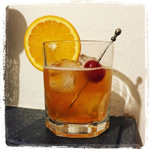 An image of the Greenwich Sour cocktail submitted by Toby that contains Rye Whiskey, Lemon, Simple Syrup, Egg, Orange, Cocktail Cherry and Dry Red Wine