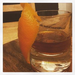 An Instagram of the The Hotel Room Temperature cocktail submitted by n0tquitethere that contains Sweet Vermouth, Gold Rum, Curaçao Triple Sec, Xocolatl Mole Bitters and Orange