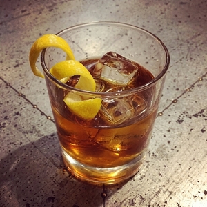 An image of the Island Old Fashioned cocktail submitted by Toby that contains Gold Rum, Falernum, Sugar Cane Syrup, Angostura Bitters and Lemon