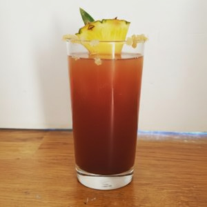 An image of the Jamaica Mule cocktail submitted by Toby that contains White Rum, Dark Rum, Gold Rum, Falernum, Lime, Ginger Beer, Pineapple and Crystallised Ginger