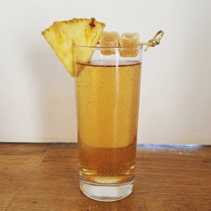 An image of the Jamaica Mule cocktail submitted by Toby that contains White Rum, Dark Rum, Gold Rum, Falernum, Lime, Ginger Beer, Pineapple and Crystallised Ginger