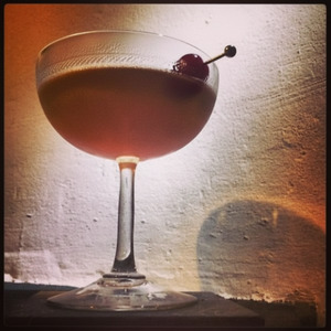 An image of the Made Man cocktail submitted by Toby that contains Rye Whiskey, Cherry Heering, Yellow Chartreuse, Fernet Branca and Cocktail Cherry