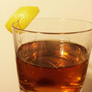 An image of the Manhattan Exposition cocktail submitted by Toby that contains Cognac, Sloe Gin, Dry Vermouth, Xocolatl Mole Bitters and Lemon