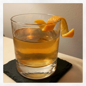 An image of the Old Fashioned Mezcal Two Step cocktail submitted by Toby that contains Mezcal, Cherry Brandy, Turin Bitters, Grapefruit, Agave Syrup, Allspice Dram, Ginger Ale and Orange