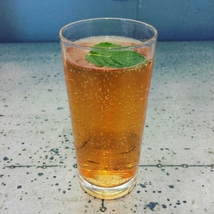 An image of the Raspberry and Rum Iced Tea cocktail submitted by Toby that contains Black Tea, Raspberry Syrup, Lemon, Dark Rum, White Rum and Mint