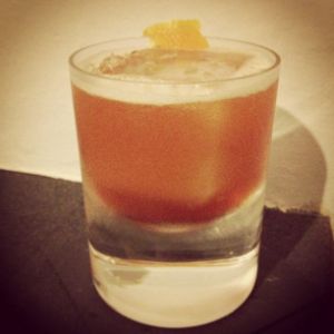 An Instagram of the Some Like It Hot cocktail submitted by n0tquitethere that contains Rye Whiskey, Aperol, Yellow Chartreuse, Orange, Whiskey Barrel Aged Bitters, Hot Sauce and Orange