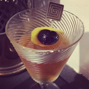 An Instagram of the Tailspin Cocktail cocktail submitted by n0tquitethere that contains London Dry Gin, Sweet Vermouth, Green Chartreuse, Orange Bitters, Lemon and Cocktail Cherry