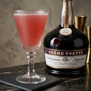 An image of the Union Jack cocktail submitted by Toby that contains London Dry Gin, Crème Yvette and Grenadine